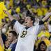 Michigan fan Kevin Slosser, Grand Rapids, celebrates after Michigan beat Notre Dame 35-31 during the first-ever night game at Michigan Stadium on Saturday. Michigan beat . Melanie Maxwell I AnnArbor.com